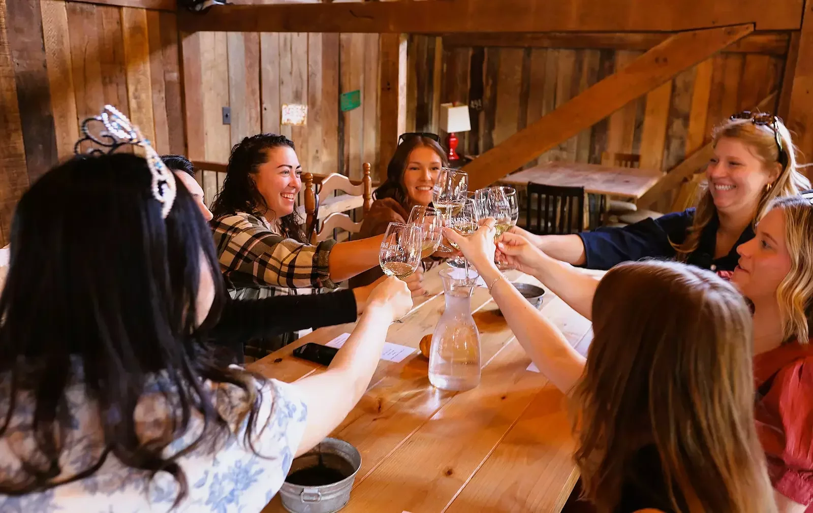 Friends raise glasses during a wine tasting at the Barns at Hamilton Station in Loudoun County, Virginia.
